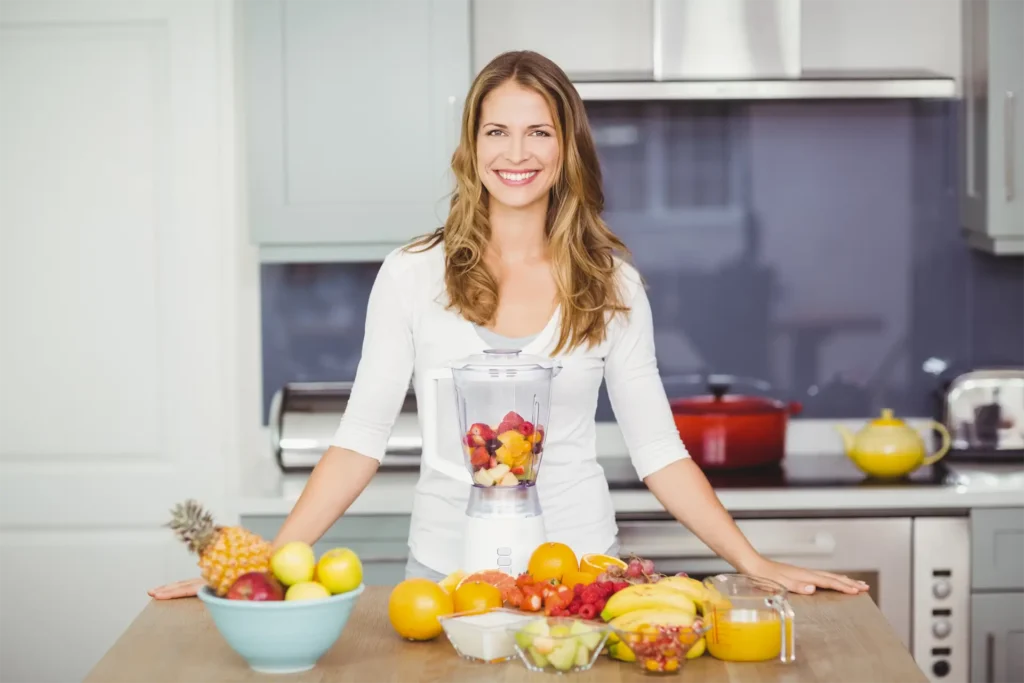 Emma Cooke smiling in a cozy kitchen, founder of First Step Recipes, a nutrition expert sharing easy homemade recipes.