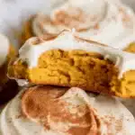 Soft Pumpkin Sugar Cookies topped with Cream Cheese Frosting, perfect fall treat.