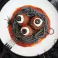 Plate of Bloody Spaghetti with Mozzarella Eyeballs, served for Halloween dinner.