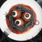 Plate of Bloody Spaghetti with Mozzarella Eyeballs, served for Halloween dinner.