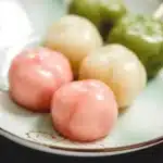 Mitarashi Dango skewers drizzled with sweet soy sauce, traditional Japanese dumplings.