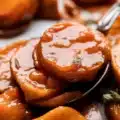 Delicious candied sweet potatoes, caramelized in a buttery glaze, perfect for Thanksgiving.