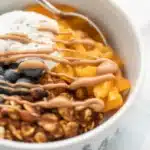 Savory sweet potato breakfast bowl with eggs, avocado, and veggies.