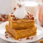 Delicious Pumpkin Crunch Cake with a crunchy topping and creamy pumpkin filling.