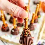 Halloween Witch's Brooms made with cheese sticks and pretzel sticks.