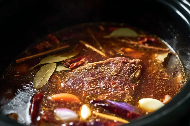 Crockpot birria tacos cooking