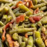 Delicious Crack Green Beans topped with crispy bacon and brown sugar glaze.