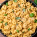 Delicious CrockPot Chicken Tortellini with tender chicken and tortellini in creamy sauce.
