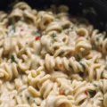 Delicious Crockpot Parmesan Chicken Pasta in creamy garlic sauce.
