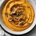 Creamy Pumpkin Whipped Feta Dip served with honey and walnuts, a perfect fall appetizer.