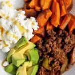 Sweet potato taco meat cottage cheese bowl with roasted sweet potatoes and ground beef.