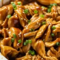 Crockpot Teriyaki Chicken served over rice with homemade sauce.