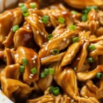 Crockpot Teriyaki Chicken served over rice with homemade sauce.