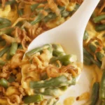 Delicious Campbells Green Bean Casserole topped with crispy fried onions.