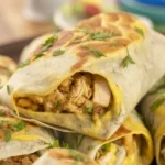 Delicious Cheesy Garlic Chicken Wraps filled with chicken, cheese, and garlic sauce.