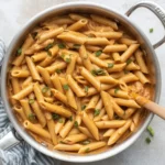 Creamy Cajun Chicken Pasta with peppers, tomatoes, and a rich sauce.