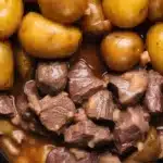 Crockpot Garlic Butter Beef Bites with Potatoes served on a plate