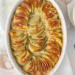 Golden creamy scalloped potatoes baked in a rich, cheesy sauce