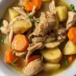 Creamy Slow Cooker Chicken Stew with vegetables and tender meat in a bowl.
