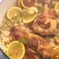 Slow Cooker Lemon Herb Chicken and Rice with herbs, chicken, and lemon zest.