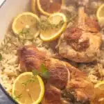 Slow Cooker Lemon Herb Chicken and Rice with herbs, chicken, and lemon zest.