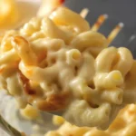 Creamy Cheesy Chicken Pasta Bake with two cheeses, chicken, and a golden breadcrumb topping.