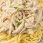 Crock Pot Angel Chicken served over pasta with cream sauce