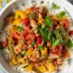 Delicious ground turkey and peppers skillet meal served with rice.