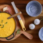 A delicious bowl of Italian Penicillin Soup with pastina, vegetables, and Parmesan cheese.