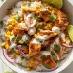 Street Corn Chicken Bowl featuring grilled chicken, charred corn, and lime sauce.