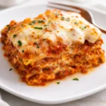 Delicious homemade lasagna with layers of pasta, meat sauce, and cheese.