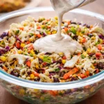 Delicious Cowboy Cabbage with coleslaw mix, black beans, corn, and creamy dressing.