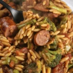 Chicken Sausage and Broccoli Orzo skillet dish with vibrant colors and savory ingredients