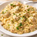 Delicious Creamy Garlic Parmesan Orzo Pasta in a bowl, garnished with parsley.