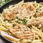 Creamy Garlic Parmesan Chicken Pasta served with tender chicken and fettuccine noodles.
