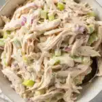 Healthy Chicken Salad with Cottage Cheese, celery, and herbs served in a bowl.