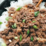 Delicious Korean Ground Beef Bowl with rice, vegetables, and a fried egg