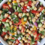 Fresh Mediterranean Chickpea Feta Salad with veggies and lemon dressing.
