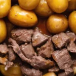 Slow Cooker Garlic Butter Beef Bites with potatoes cooked in rich garlic butter sauce.