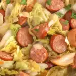 Sausage and Cabbage Stir Fry with kielbasa and garlic in a skillet