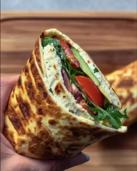 High protein cottage cheese wrap with fresh ingredients on a plate