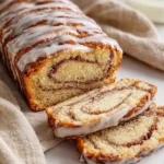 Delicious Sourdough Discard Cinnamon Quick Bread loaf drizzled with vanilla glaze.