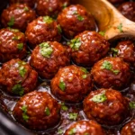 Easy Grape Jelly Meatballs with flavorful sauce served in a dish.
