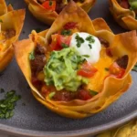 Delicious Taco Cups served on a plate with toppings