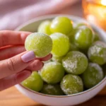 A bowl of frozen grapes, a healthy and refreshing snack choice.