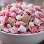 Valentine's Day themed Muddy Buddies snack mix in heart-shaped bowl