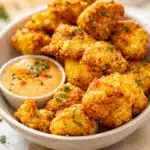 Easy Air Fryer Bang Bang Cauliflower Recipe with crispy texture and spicy sauce.