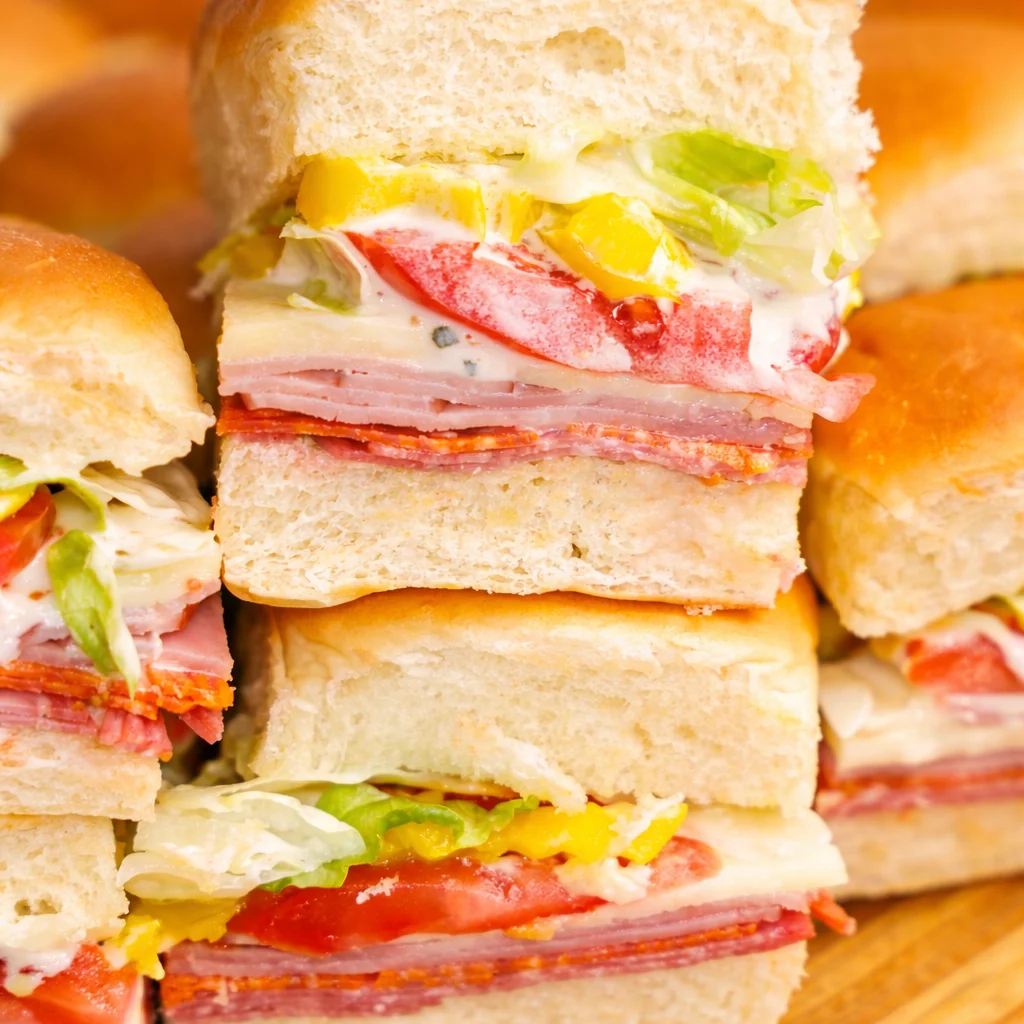 Delicious cold Italian sliders on Hawaiian rolls with salami, pepperoni, and provolone cheese.