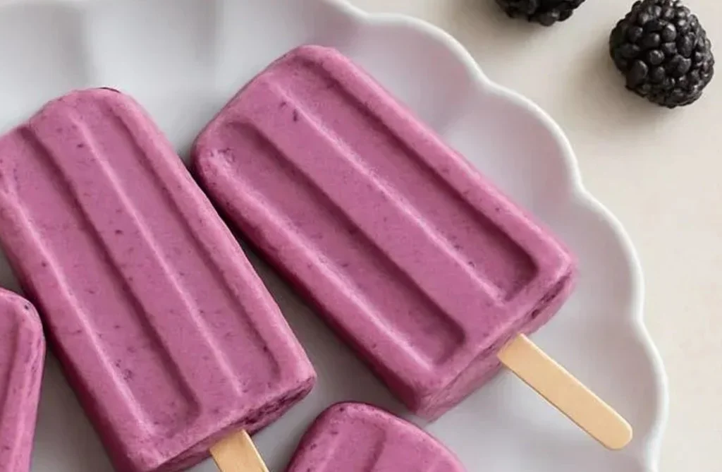 Greek yogurt popsicles served on a colorful plate