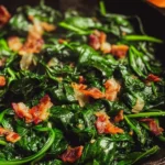 Sautéed spinach with crispy bacon served in a bowl